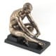 FIGURA HOMBRE SENTADO DESNUDO