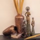 FIGURA AFRICANA PLANTADA CON JARRÓN RESINA DORADO 14X11X35 CM.